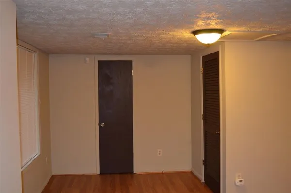 a view of hallway with wooden floor