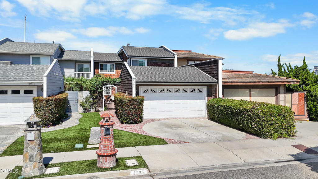 4505 Gateshead Bay Oxnard, CA 93035 - Photo 1 of 41 a front view of a house with a yard and garage