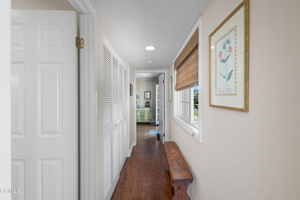 4505 Gateshead Bay Oxnard, CA 93035 - Photo 12 of 41 a view of a hallway with wooden shelves