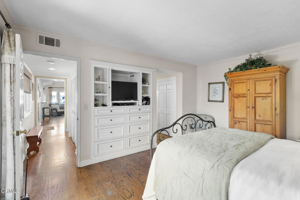 4505 Gateshead Bay Oxnard, CA 93035 - Photo 15 of 41 a bedroom with a bed and a flat screen tv