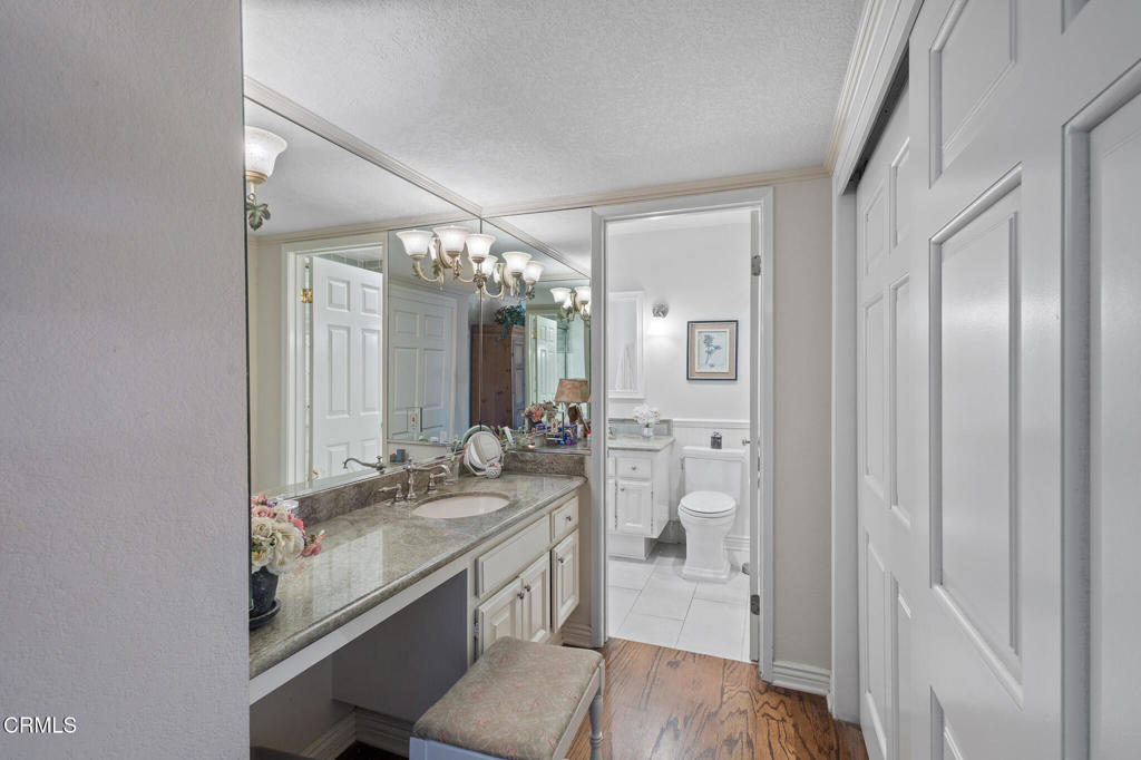 4505 Gateshead Bay Oxnard, CA 93035 - Photo 16 of 41 a spacious bathroom with a granite countertop sink mirror and a shower