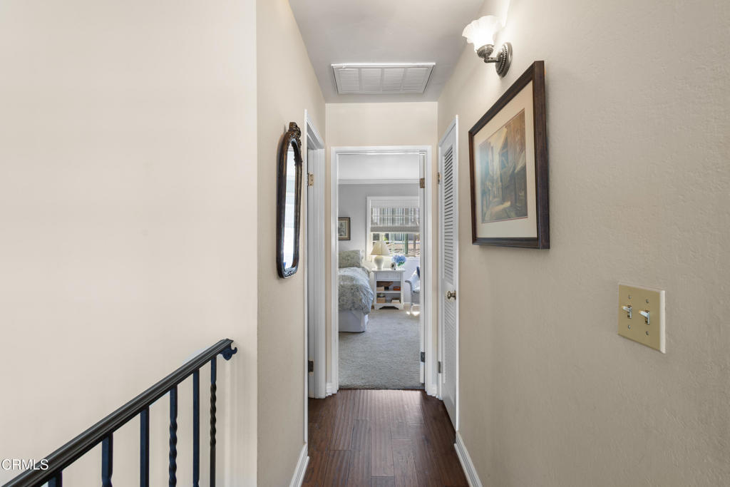 4505 Gateshead Bay Oxnard, CA 93035 - Photo 26 of 41 a view of a hallway with wooden floor and a bathroom