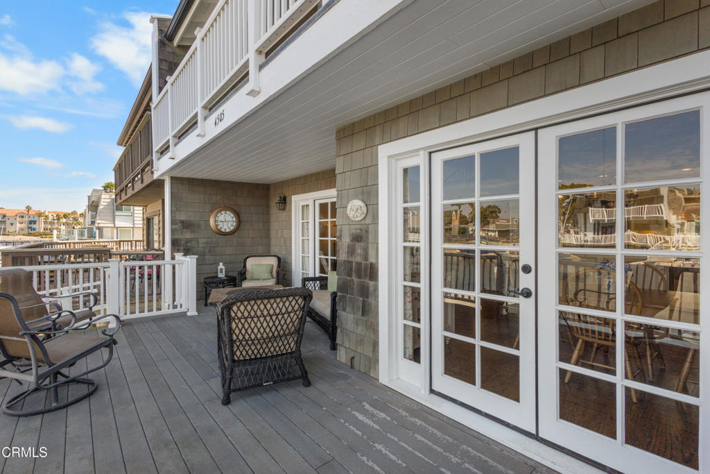 4505 Gateshead Bay Oxnard, CA 93035 - Photo 30 of 41 a view of a deck with table and chairs and wooden floor