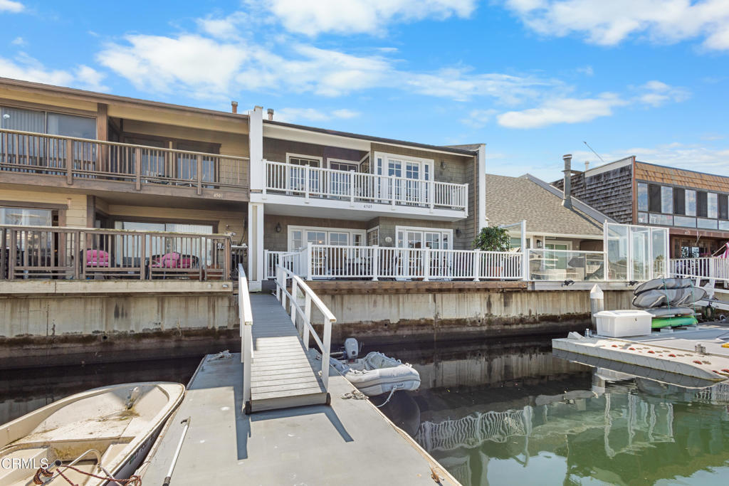 4505 Gateshead Bay Oxnard, CA 93035 - Photo 35 of 41 a view of roof deck with dining table and chairs