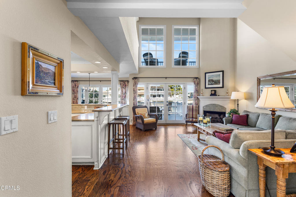 4505 Gateshead Bay Oxnard, CA 93035 - Photo 5 of 41 a living room with fireplace furniture and a wooden floor