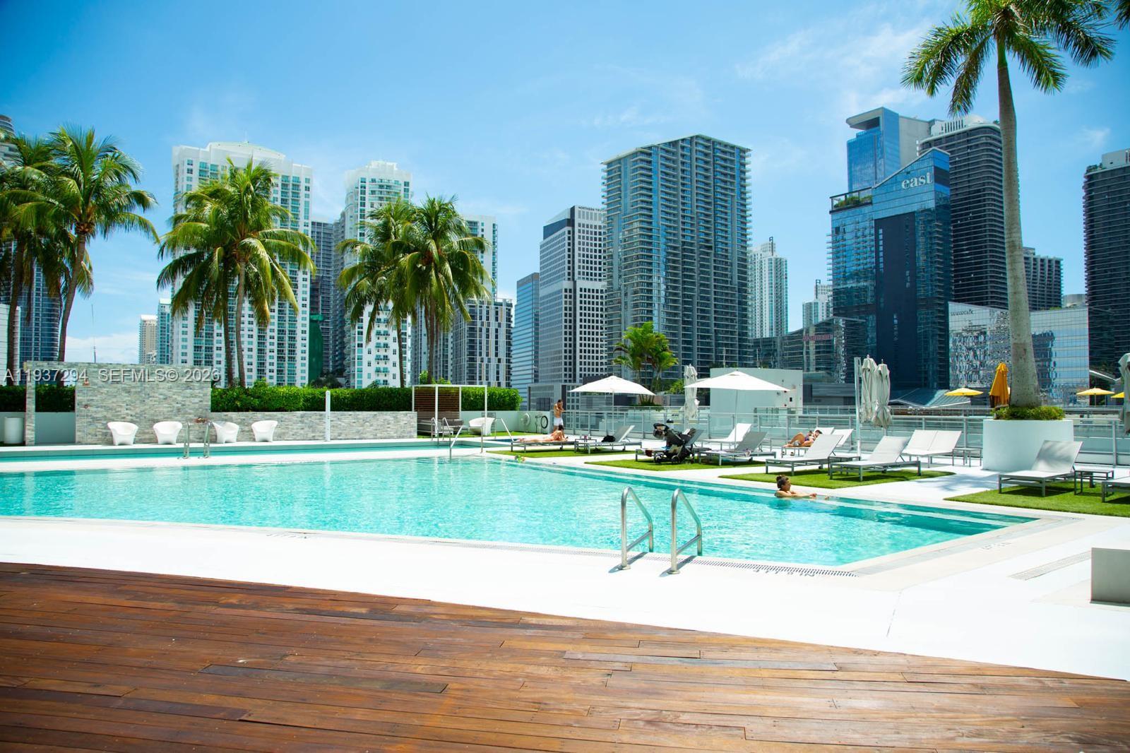 90 Southwest 3rd Street, Unit 2703 Miami, FL 33130 - Photo 17 of 28 a view of a swimming pool and a yard