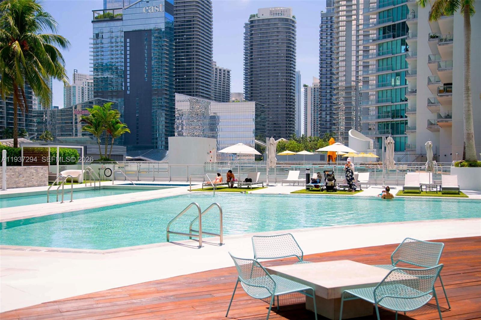 90 Southwest 3rd Street, Unit 2703 Miami, FL 33130 - Photo 18 of 28 a view of swimming pool with outdoor seating