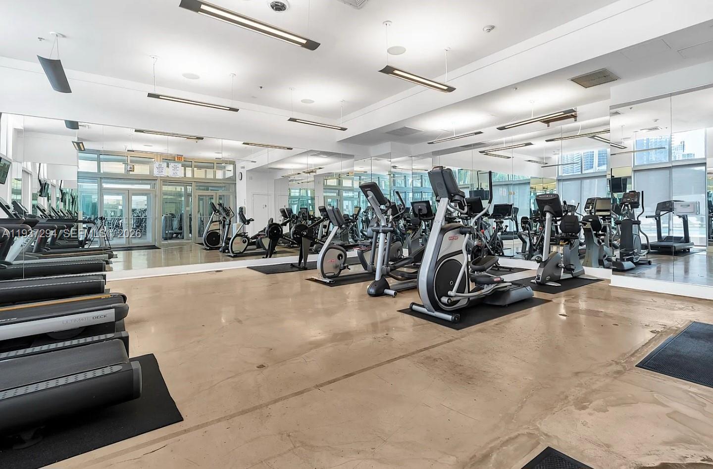 90 Southwest 3rd Street, Unit 2703 Miami, FL 33130 - Photo 22 of 28 a view of a room with gym equipment