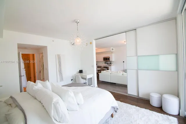 a bedroom with a bed and a couch