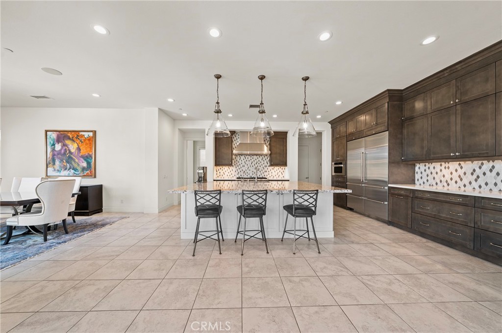 52 Eider Run Irvine, CA 92618 - Photo 27 of 46 a large kitchen with a table and chairs