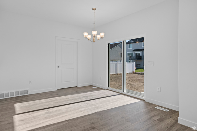 2823 North 710 West, Unit 16 Logan, UT 84321 - Photo 14 of 22 Unfurnished dining area with suspended lighting and light wood-style floors
