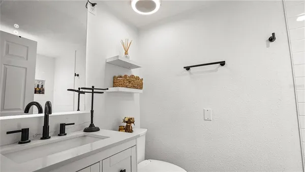 a bathroom with a sink and a toilet