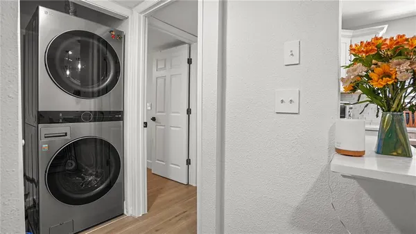 a view of a hallway with washer and dryer
