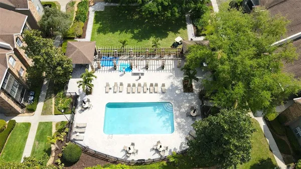 a view of a house with a yard and garden