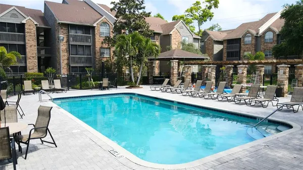 a swimming pool with outdoor seating yard and livingroom