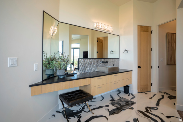 3606 South Cypress Road Hurricane, UT 84737 - Photo 33 of 69 Bathroom with vanity and decorative backsplash