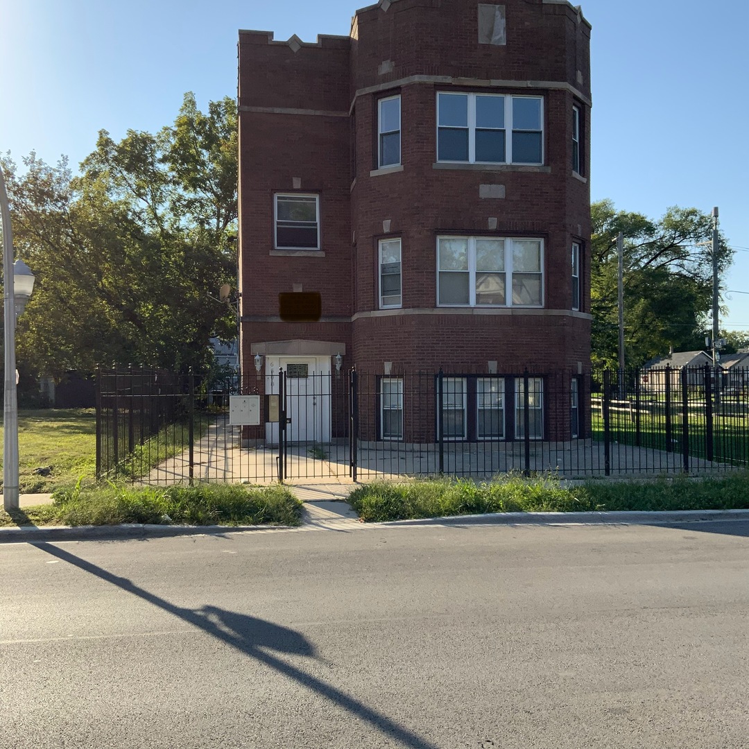 6508 South Morgan Street, Unit 3 Chicago, IL 60621 - Photo 1 of 11 a front view of a house with a yard and plants