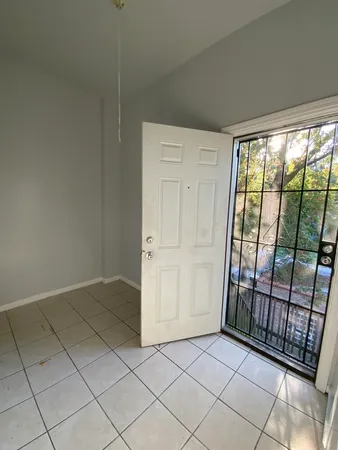 a view of an empty room and window