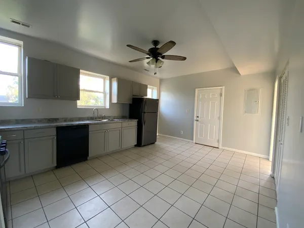 a large kitchen with a cabinets