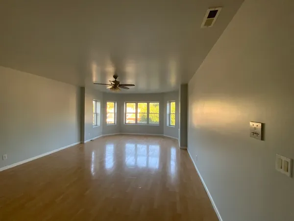 a view of an empty room with a window