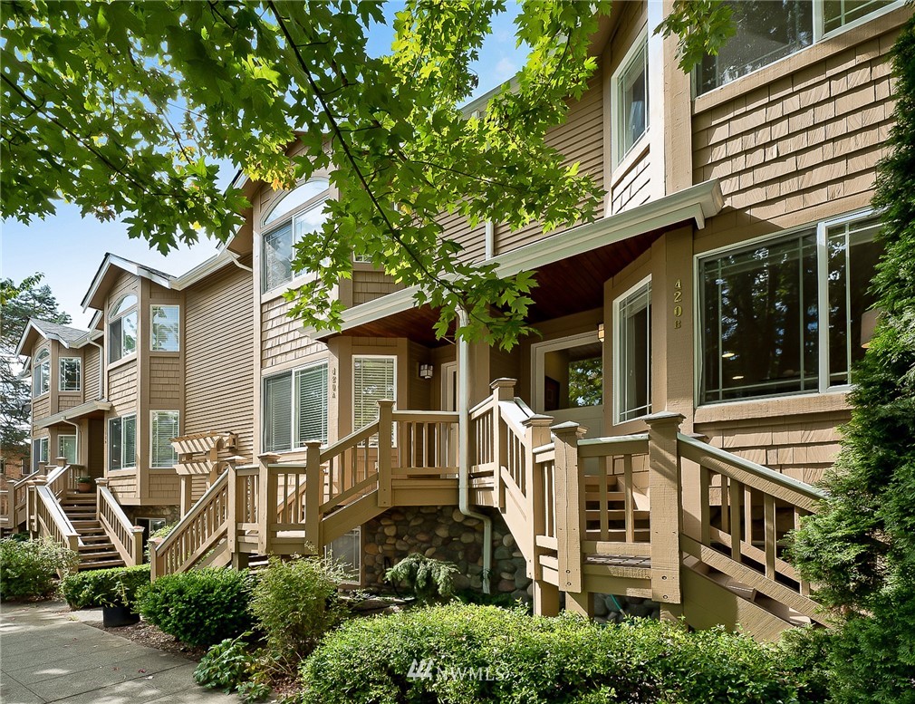 front view of a house with a tree