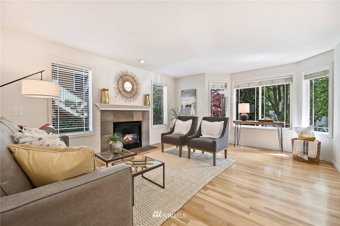 420 Northeast Maple Leaf Place, Unit B Seattle, WA 98115 - Photo 6 of 24 a living room with furniture and a fireplace