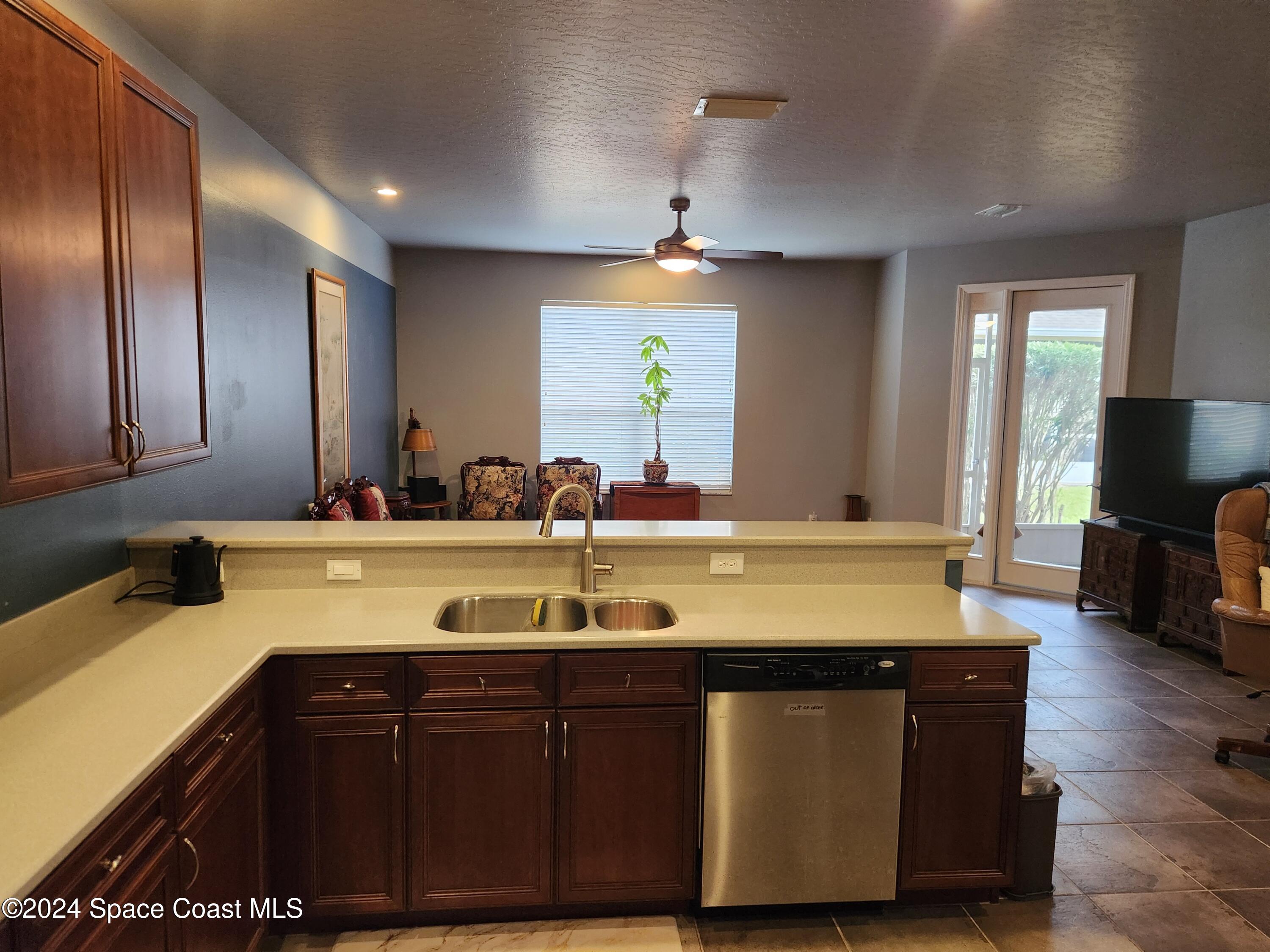 373 Intrepid Way Indialantic, FL 32903 - Photo 12 of 59 a bathroom with a granite countertop sink a large mirror and vanity