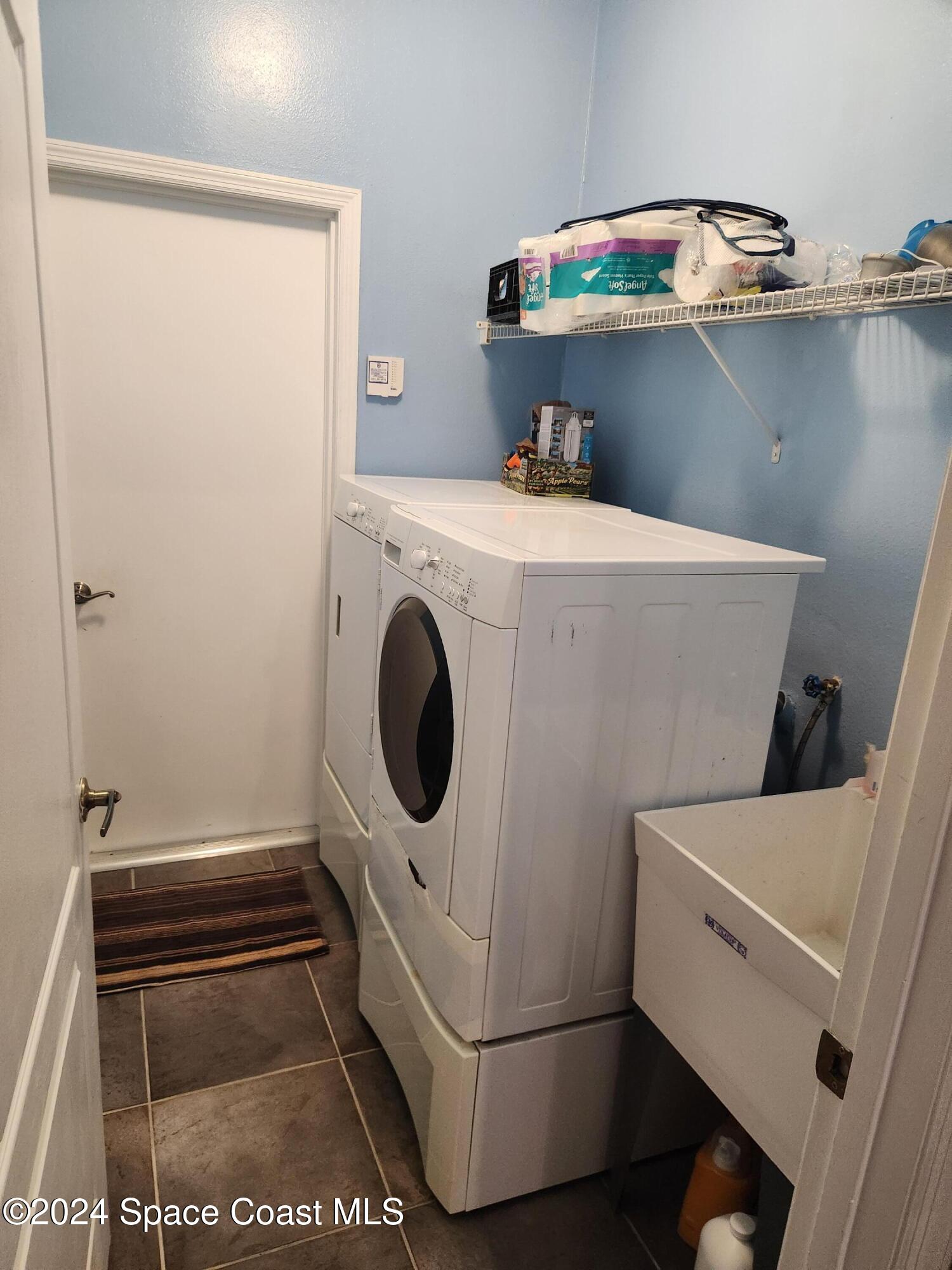 373 Intrepid Way Indialantic, FL 32903 - Photo 13 of 59 a utility room with dryer and washer