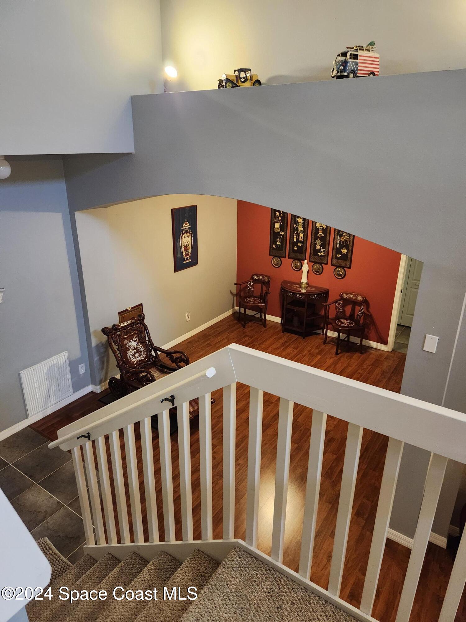 373 Intrepid Way Indialantic, FL 32903 - Photo 20 of 59 a view of wooden floor in hallway