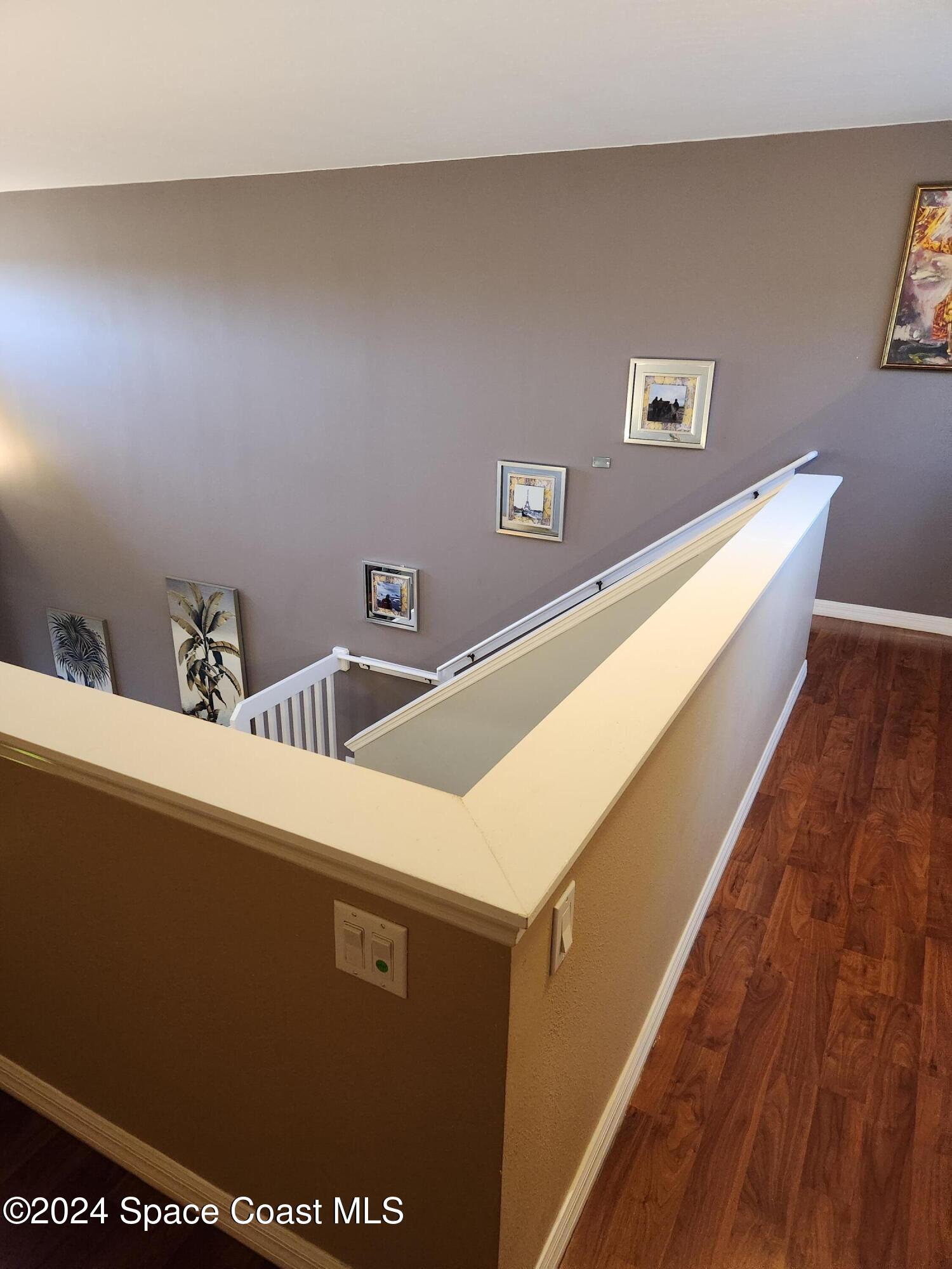 373 Intrepid Way Indialantic, FL 32903 - Photo 23 of 59 a view of a living room with stainless steel appliances wooden floor and a large window
