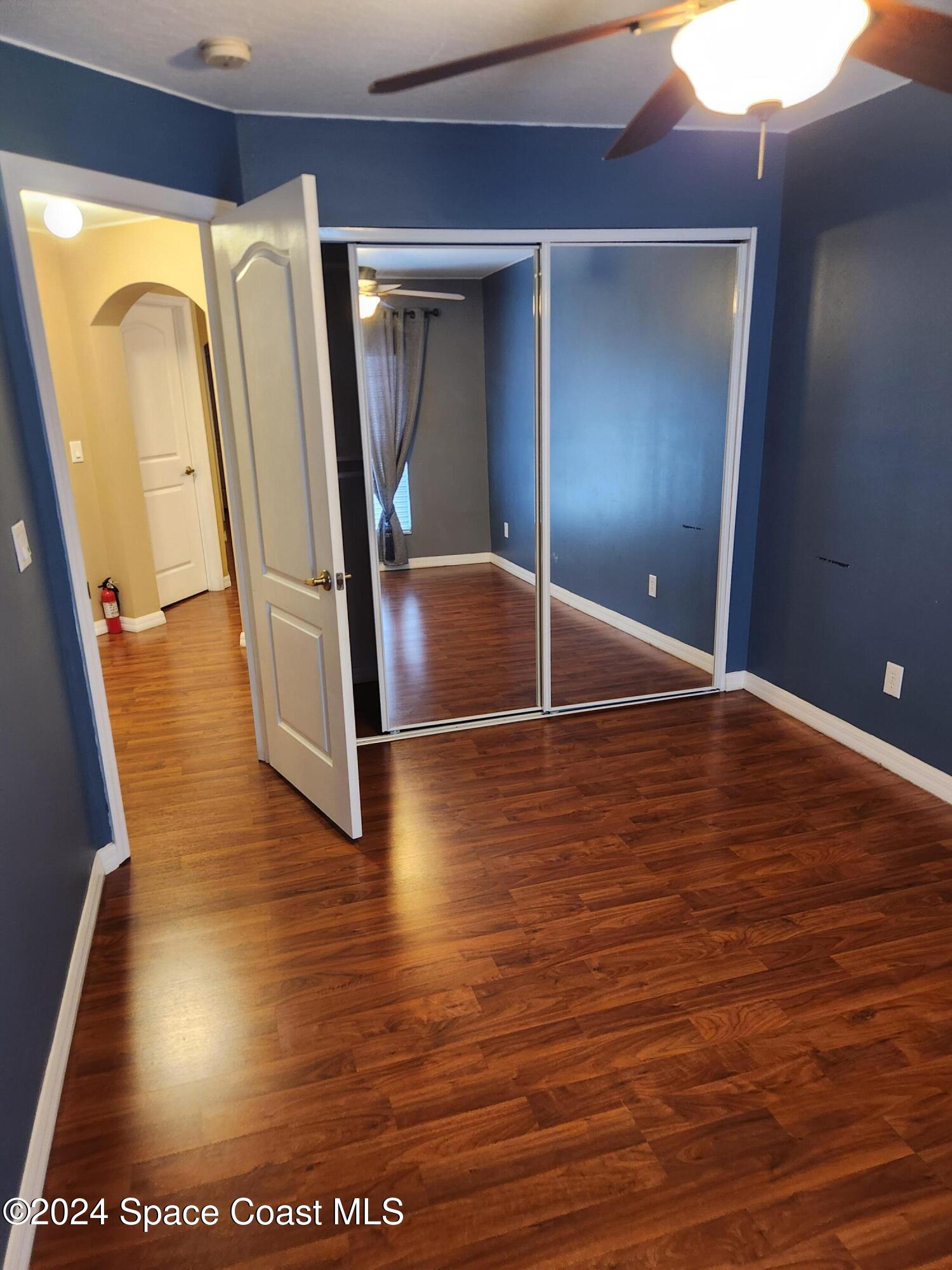 373 Intrepid Way Indialantic, FL 32903 - Photo 27 of 59 a view of a hallway with wooden floor