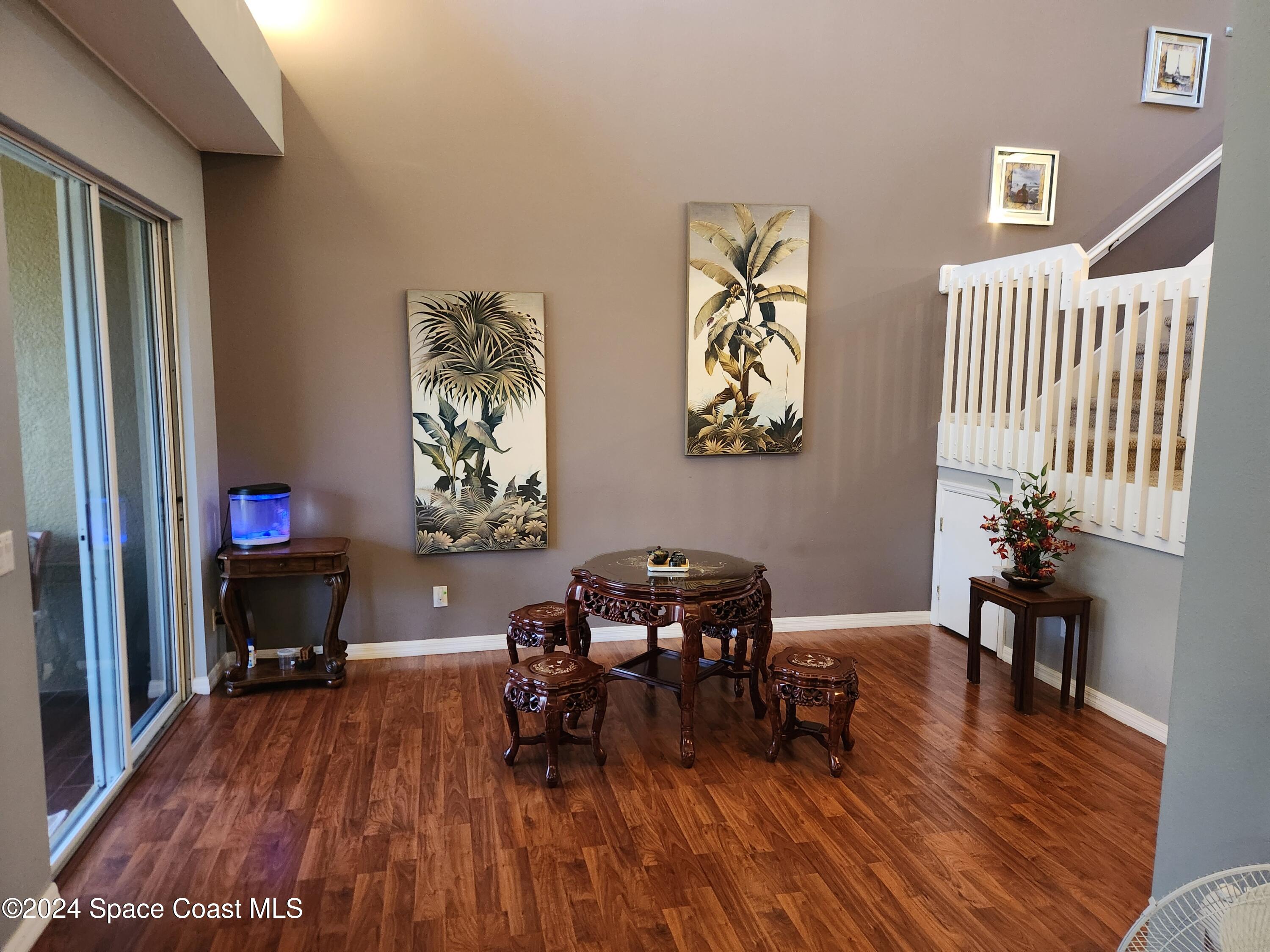 373 Intrepid Way Indialantic, FL 32903 - Photo 3 of 59 a workspace with furniture wooden floor and a window
