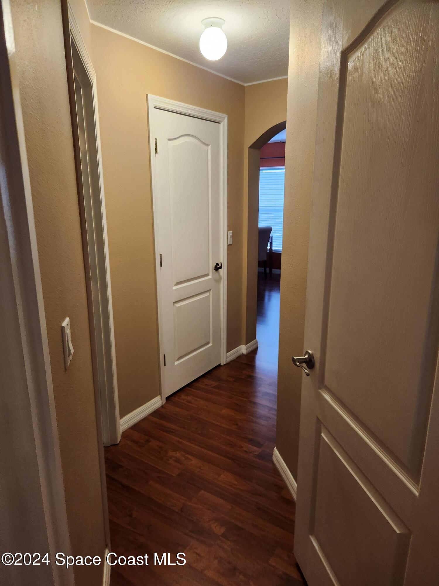 373 Intrepid Way Indialantic, FL 32903 - Photo 35 of 59 a view of a hallway with wooden floor