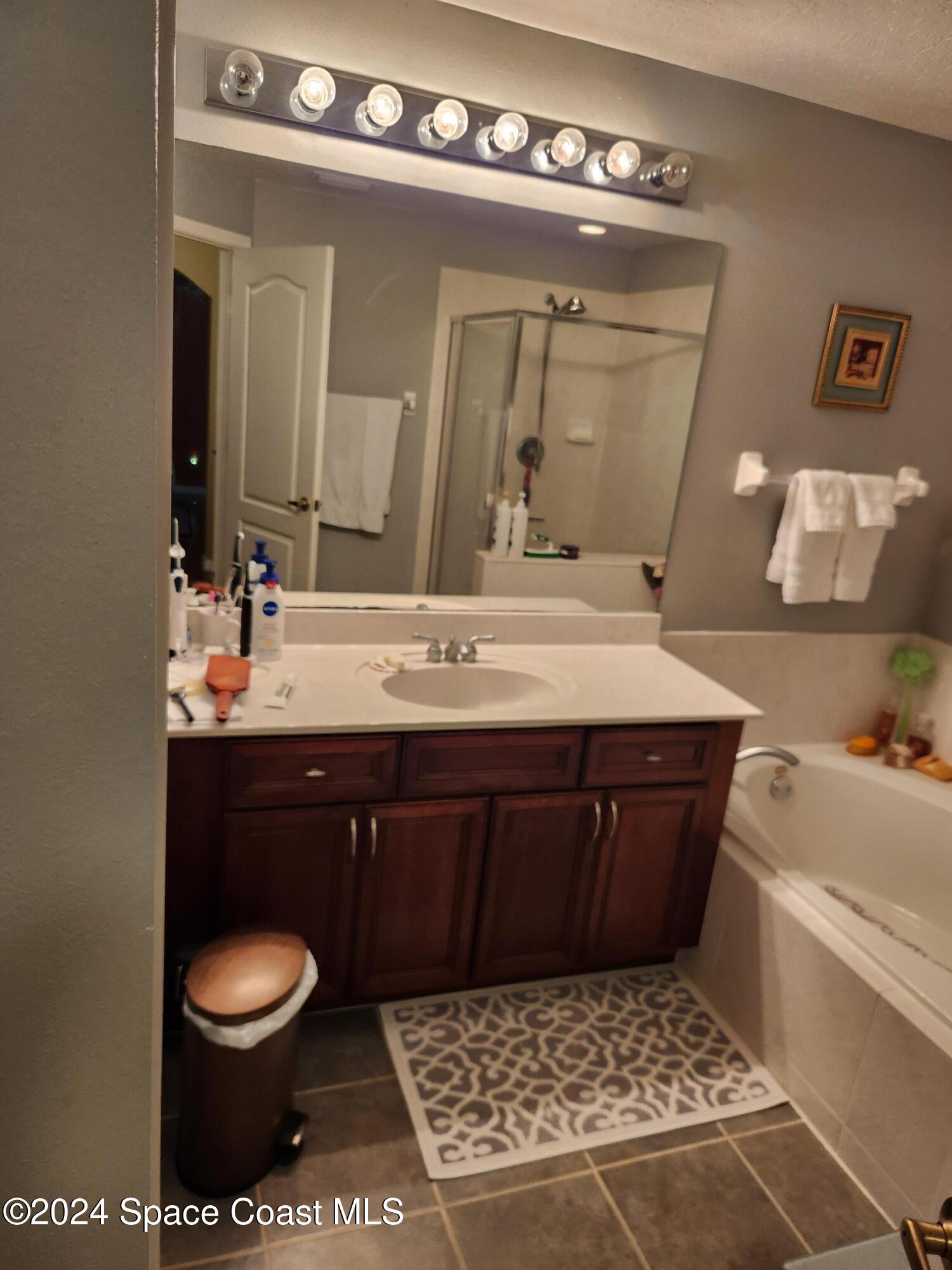 373 Intrepid Way Indialantic, FL 32903 - Photo 37 of 59 a bathroom with a sink and a mirror