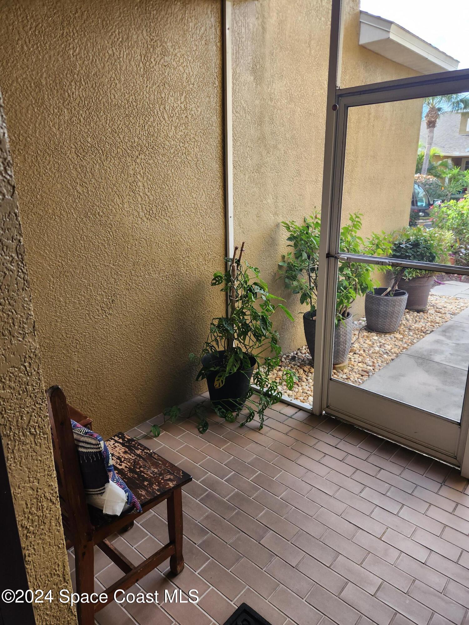 373 Intrepid Way Indialantic, FL 32903 - Photo 48 of 59 a backyard of a house with seating space