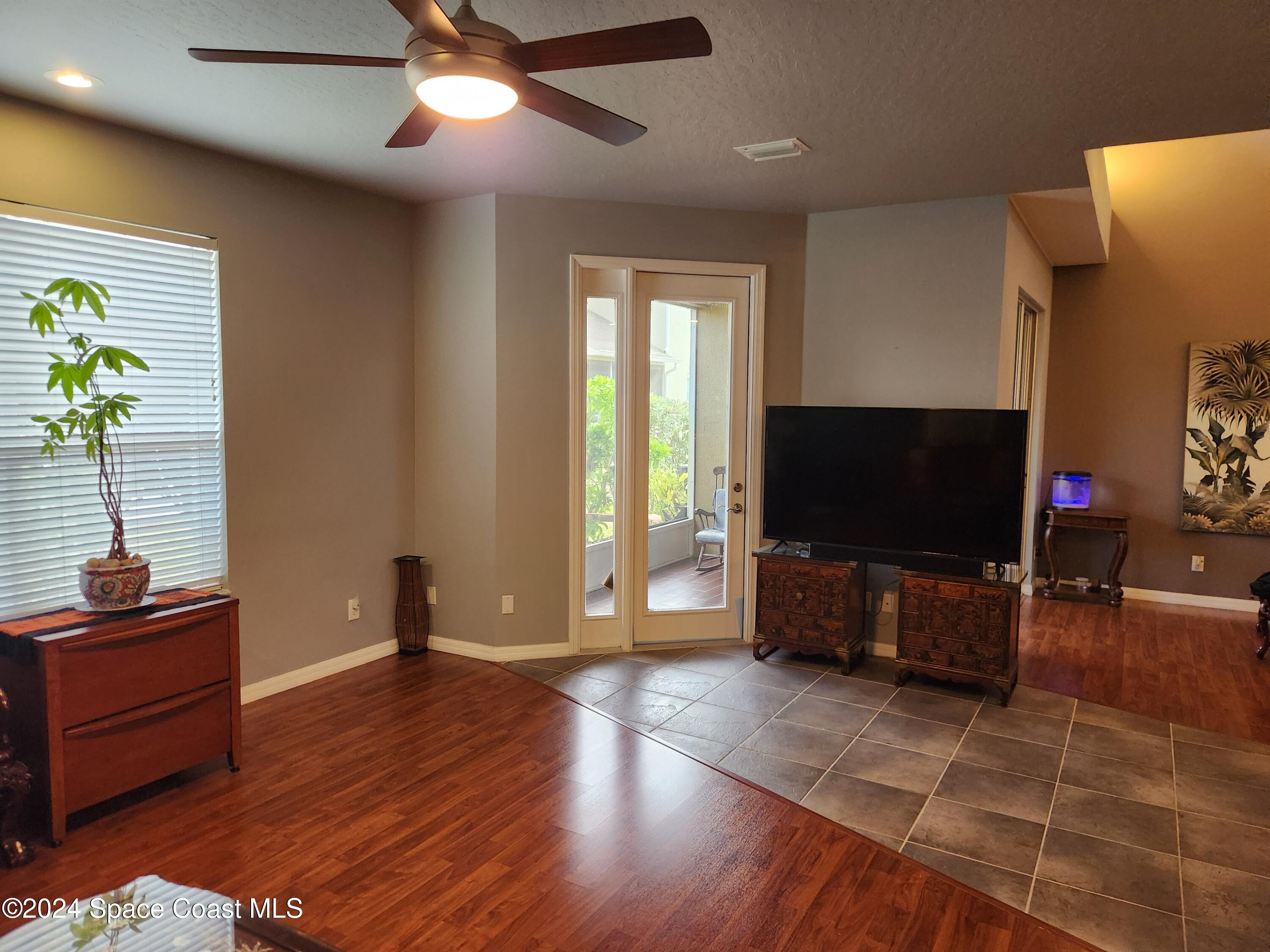 373 Intrepid Way Indialantic, FL 32903 - Photo 5 of 59 a living room with furniture and a flat screen tv