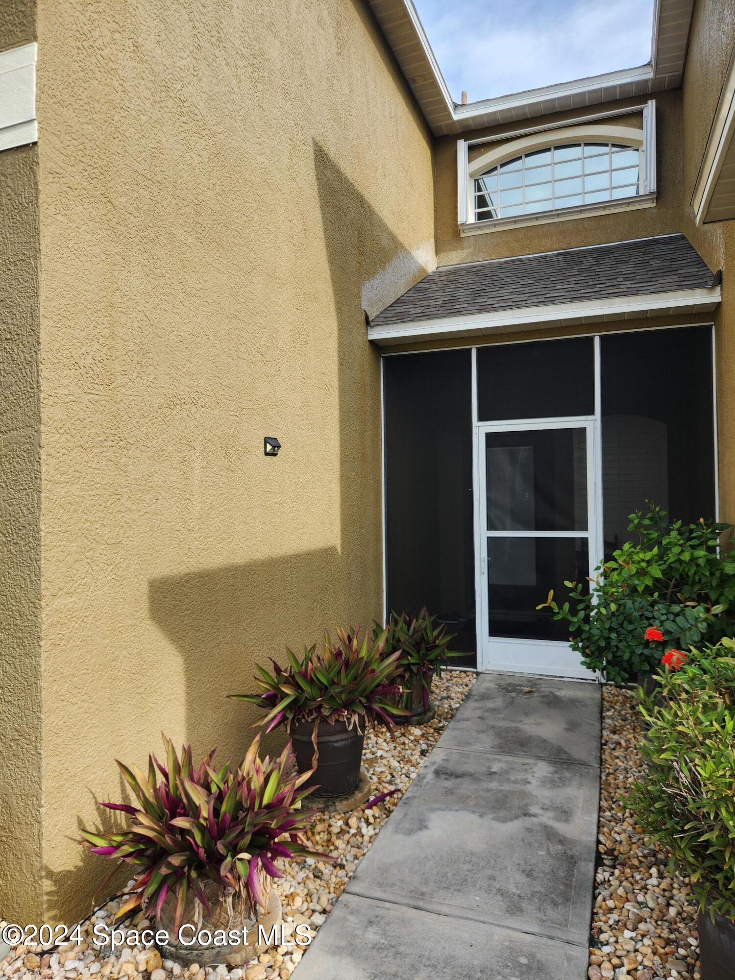 373 Intrepid Way Indialantic, FL 32903 - Photo 55 of 59 a front view of a house with a yard