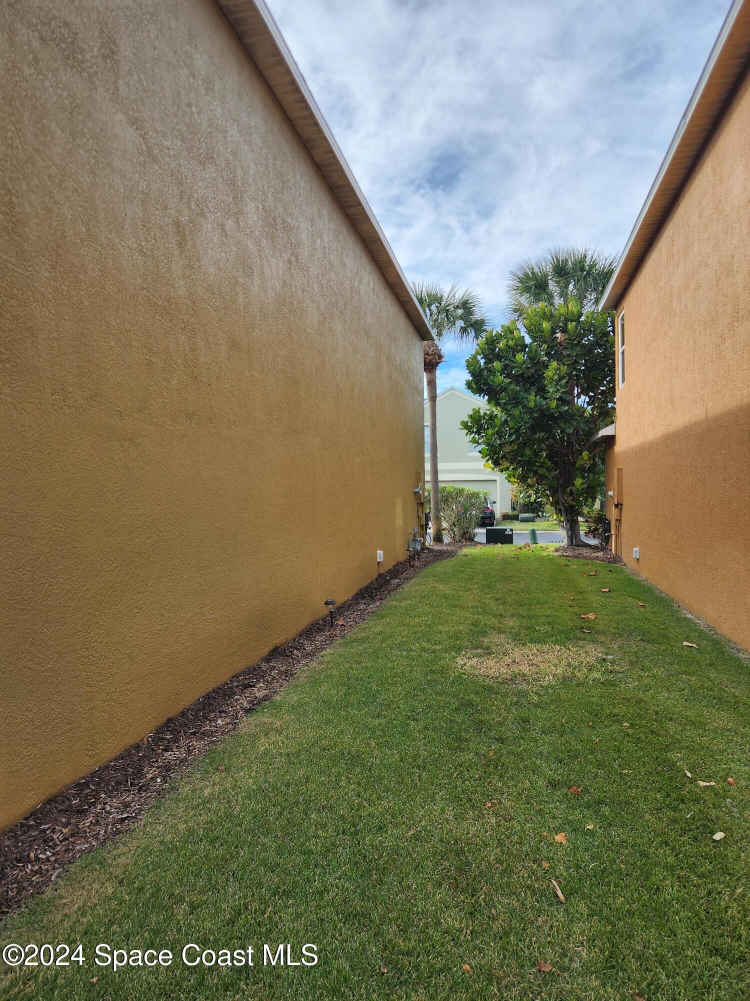 373 Intrepid Way Indialantic, FL 32903 - Photo 56 of 59 a view of yard with staircase