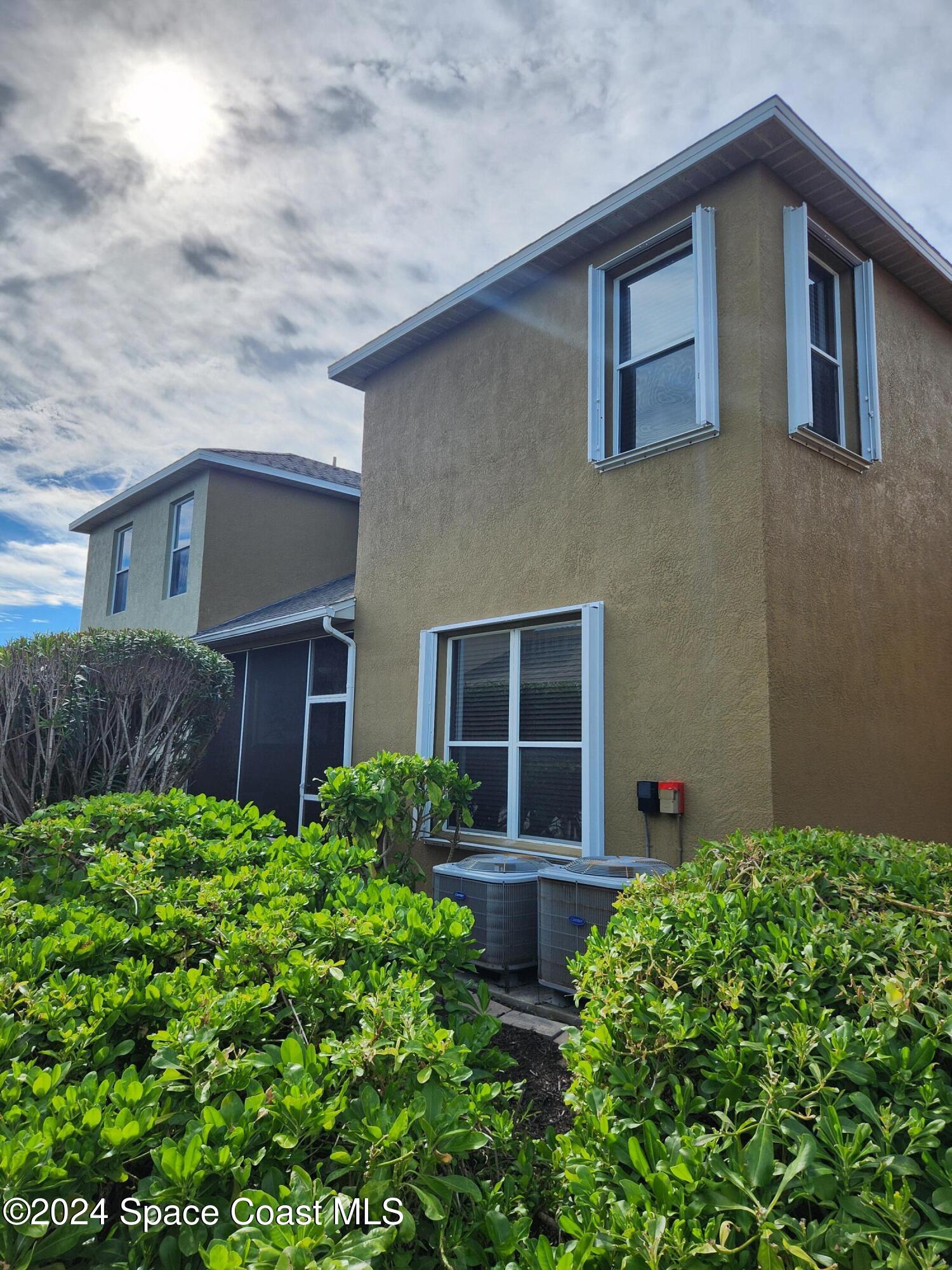 373 Intrepid Way Indialantic, FL 32903 - Photo 58 of 59 a house that has a lot of plants in it