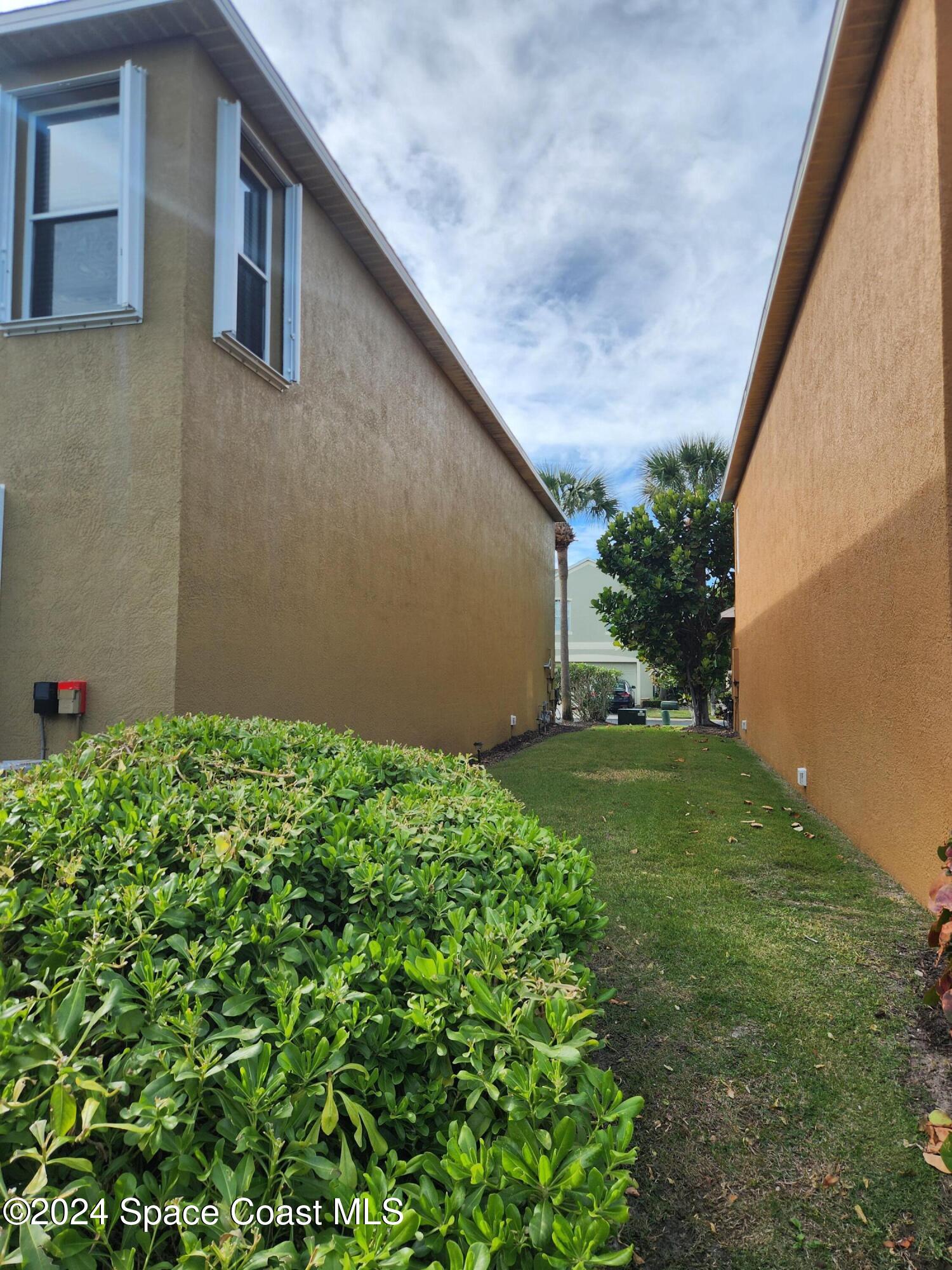 373 Intrepid Way Indialantic, FL 32903 - Photo 59 of 59 a backyard of a house with lots of green space
