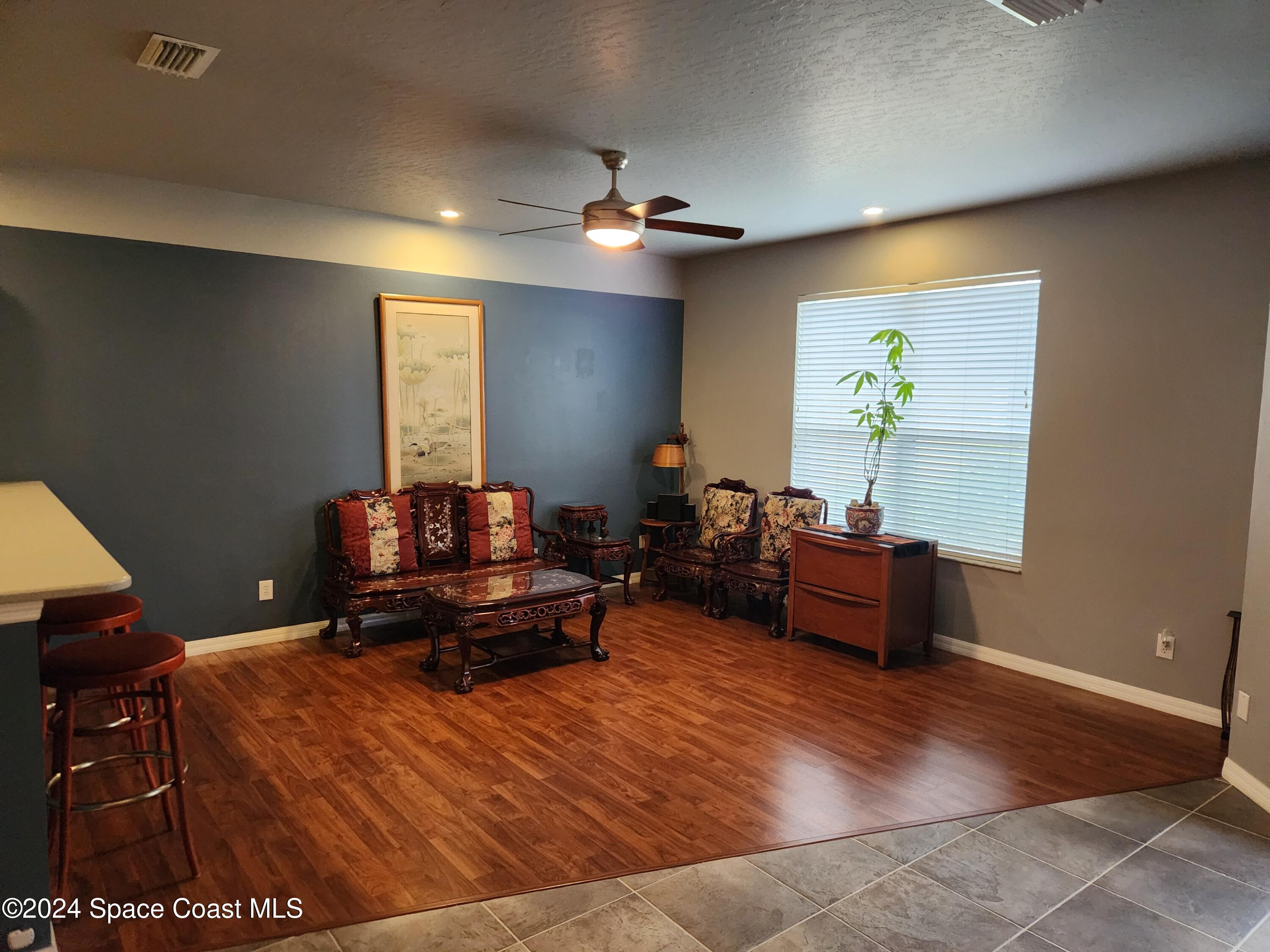 373 Intrepid Way Indialantic, FL 32903 - Photo 7 of 59 a living room with furniture and a piano