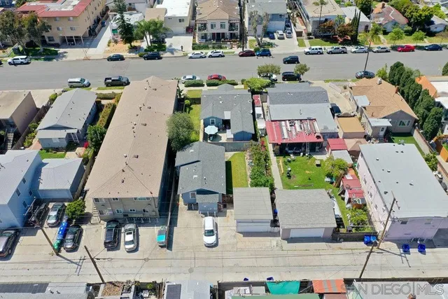 an aerial view of houses with outdoor space