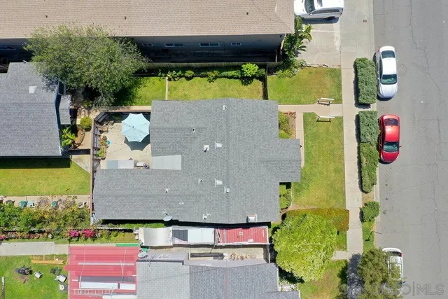 an aerial view of house with yard swimming pool and outdoor seating