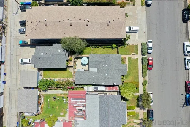 an aerial view of residential house with outdoor space and swimming pool