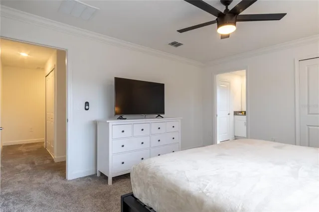 a bathroom with a granite countertop sink mirror and toilet