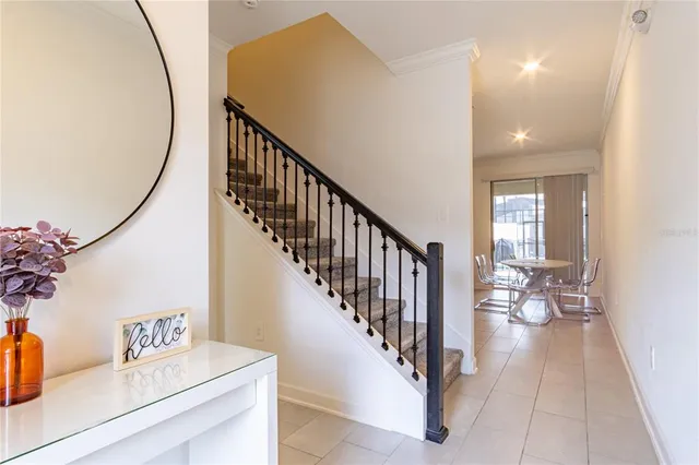 a view of entryway and hall with wooden floor
