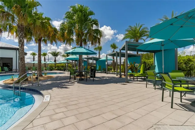 a view of a patio with table and chairs