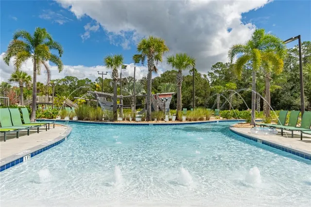 a view of a swimming pool with chairs
