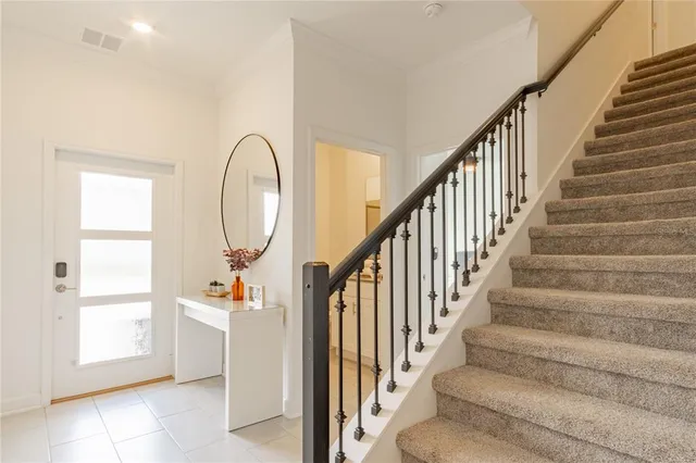 a view of entryway with wooden floor and staircase