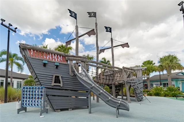 a view of a room with lots of furniture and wooden floors